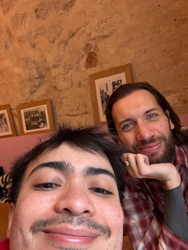 Two people take selfie inside Paris building