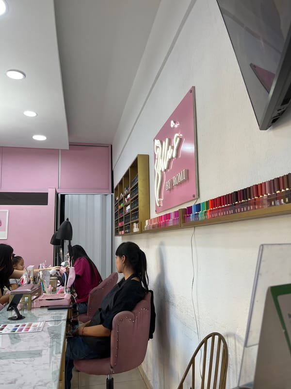 Evening nail salon service observed with multiple clients