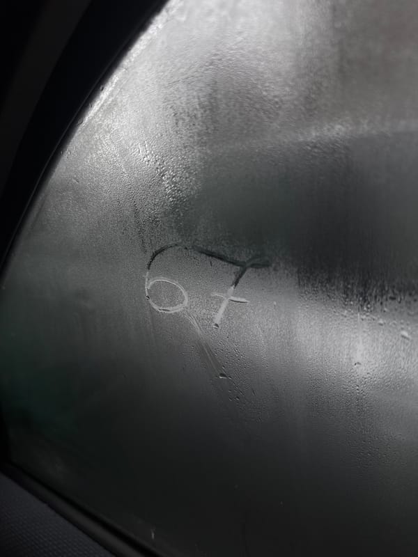 Person draws figure on fogged car window in Bulgaria