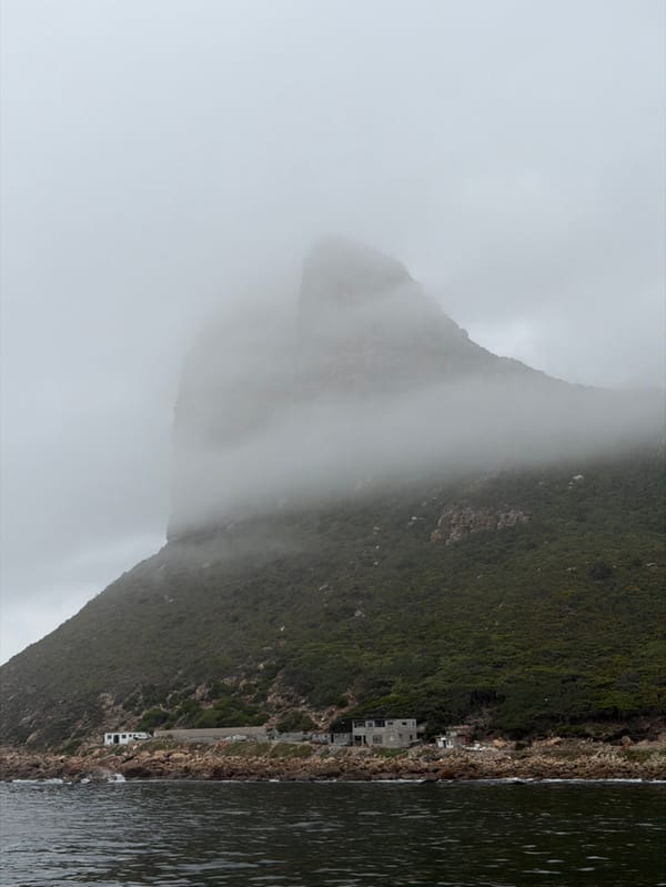 Dense fog shrouds Hout Bay mountain under overcast skies