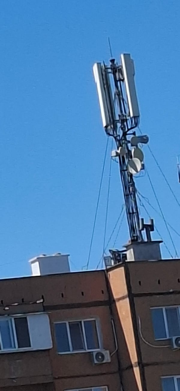 Rooftop antennas, a blue bottle, and a bulletin board in Vidin