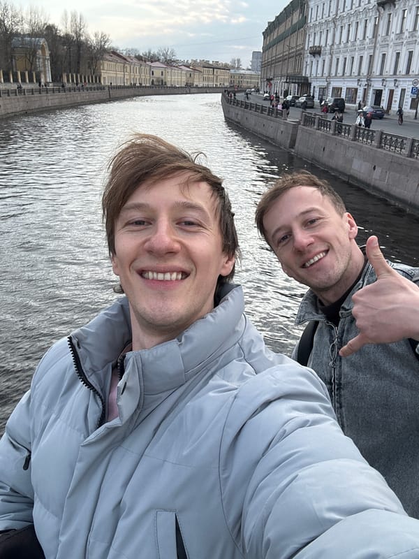 Tourists take selfies near Saint Petersburg landmark and karaoke bars