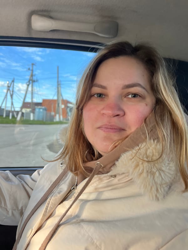 Woman takes selfies during car journey in rural Russia