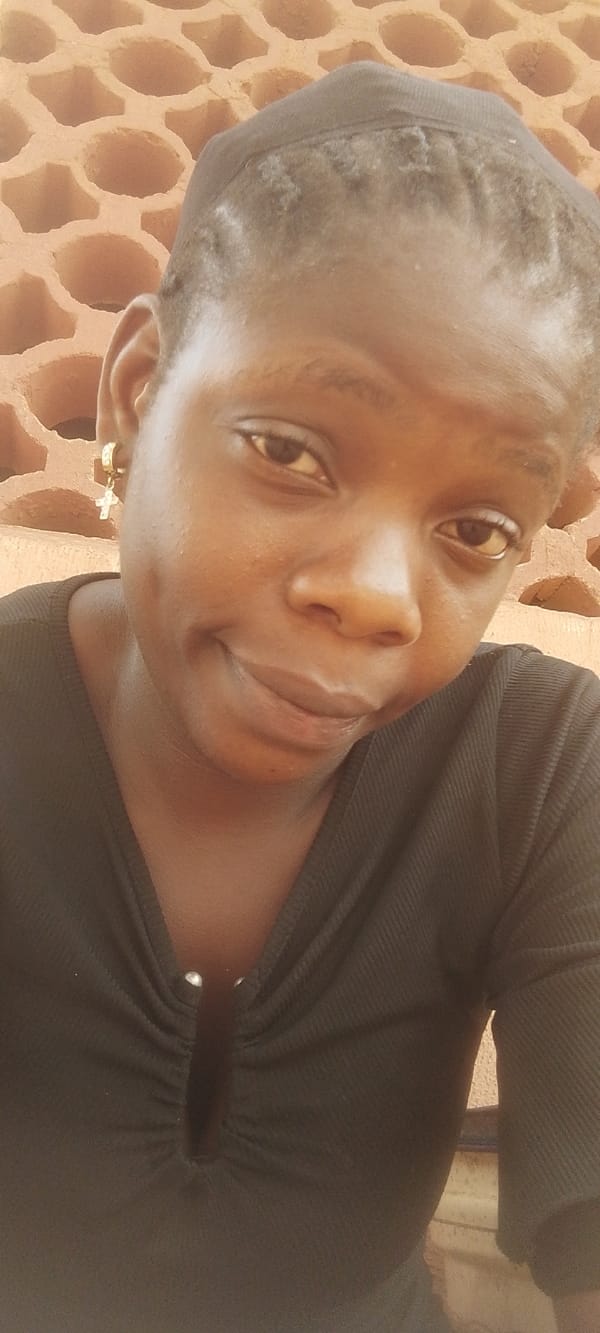 Woman photographed in black top with silver details