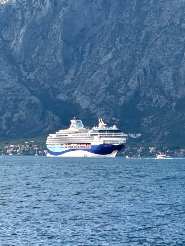 Bay of Kotor waterfront busy with ships on a summer afternoon