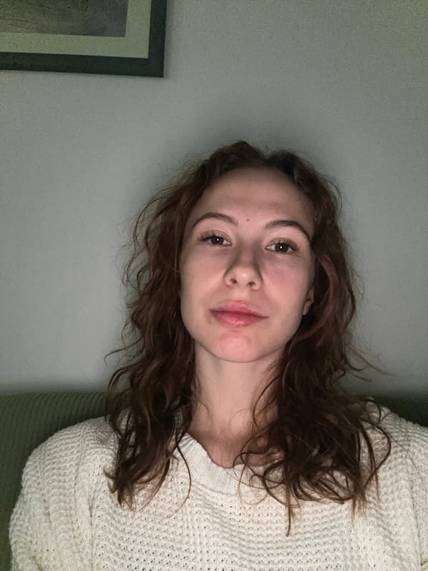 Woman takes multiple selfies indoors in Novi Sad
