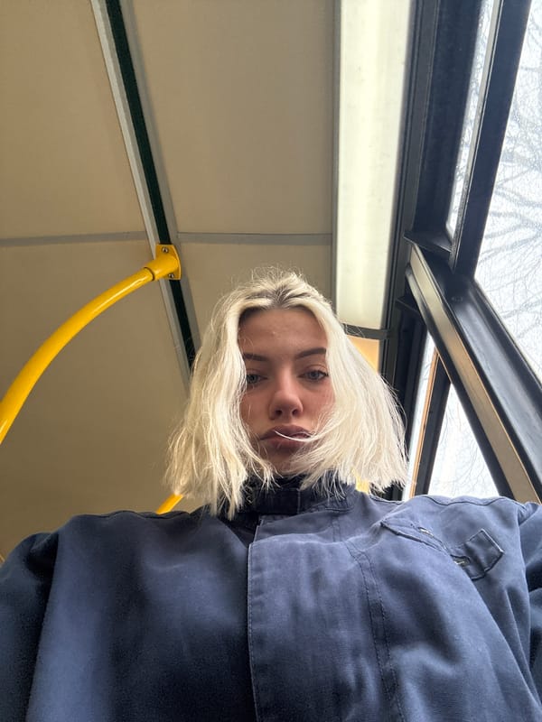 Person photographed from low angle in Manchester morning