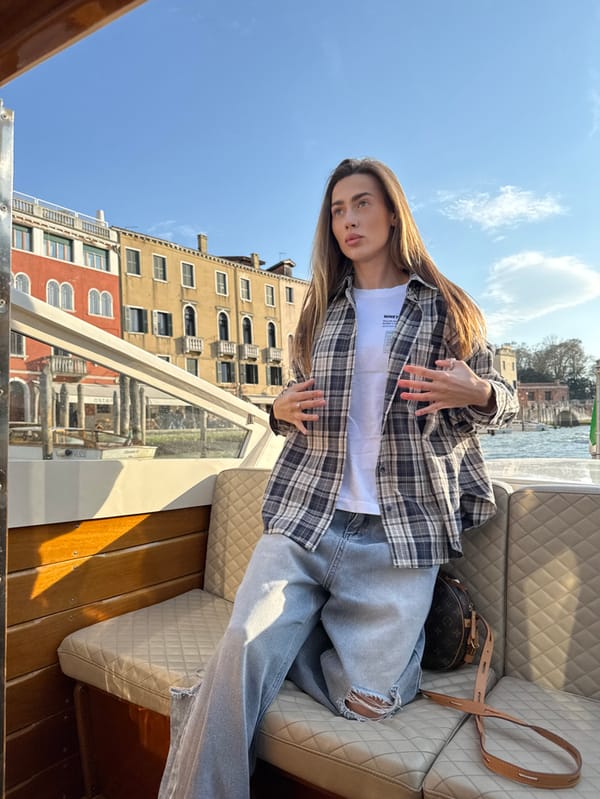 Woman Takes Scenic Boat Ride Through Venice Canals