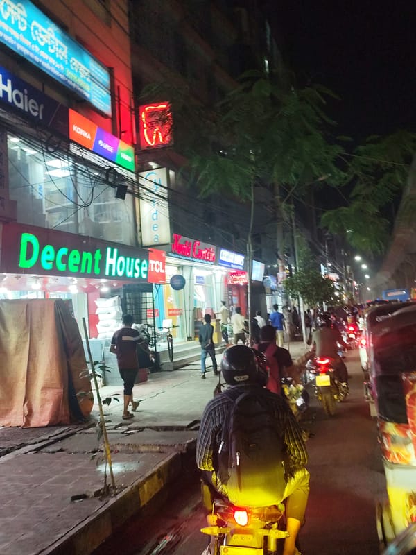 Construction disrupts nighttime streets in Dhaka amid ongoing business activity