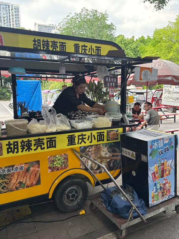 Early morning street vendors, workers active in Chongqing district