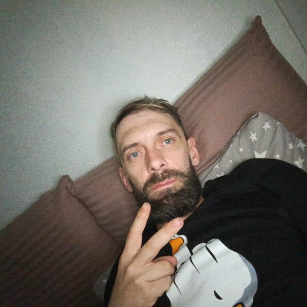 Man takes selfie indoors in Markovskiy, Russia