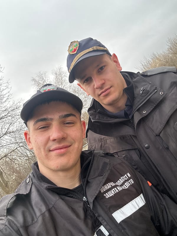 Two uniformed men pose for selfie in Sofia