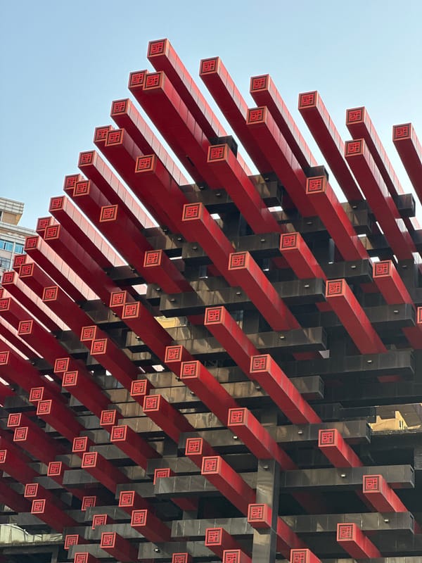 Tourist photographs Chongqing landmarks with smartphone in Yuzhong District