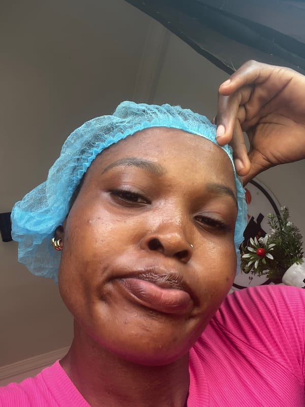 Medical worker adjusts surgical cap in Lekki, Nigeria