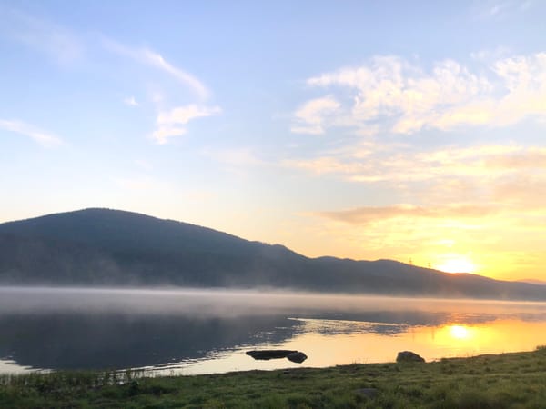 Sunrise photographed over calm lake near Krasnoyarsk, Russia