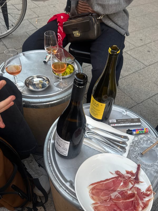 Wine and ham dining scene captured in Al Jizah