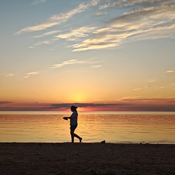 Sunset observed by beachgoers in Shcholkino, Ukraine
