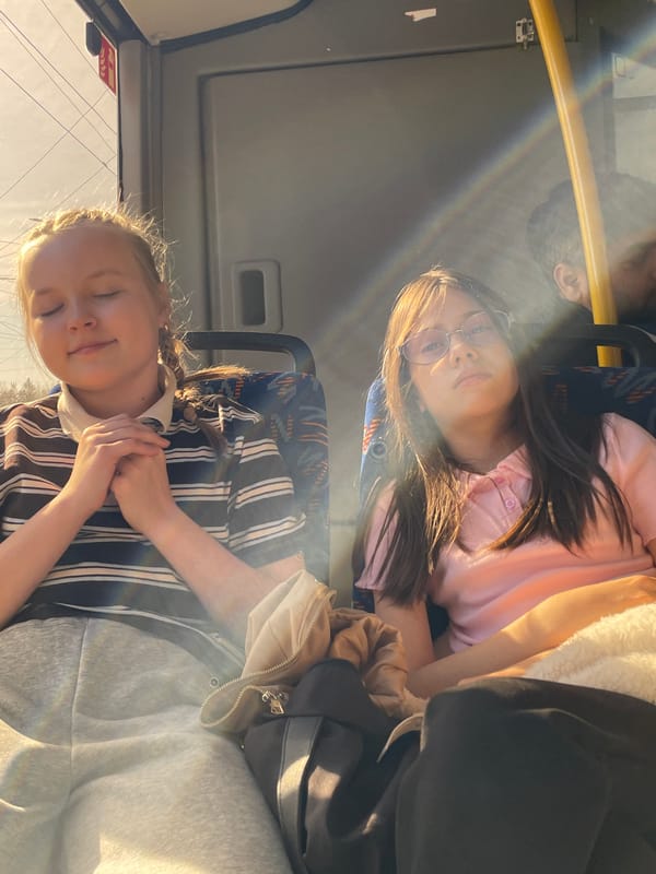 Two women ride bus in Izhevsk during morning commute
