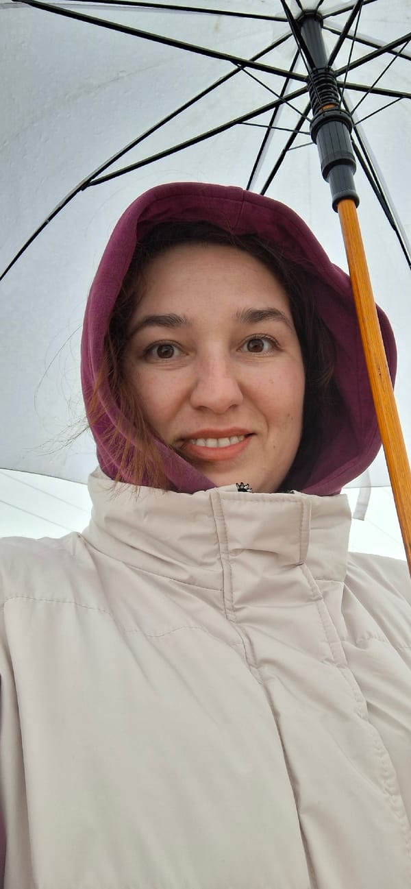 Woman with umbrella poses for photo in Chernushka