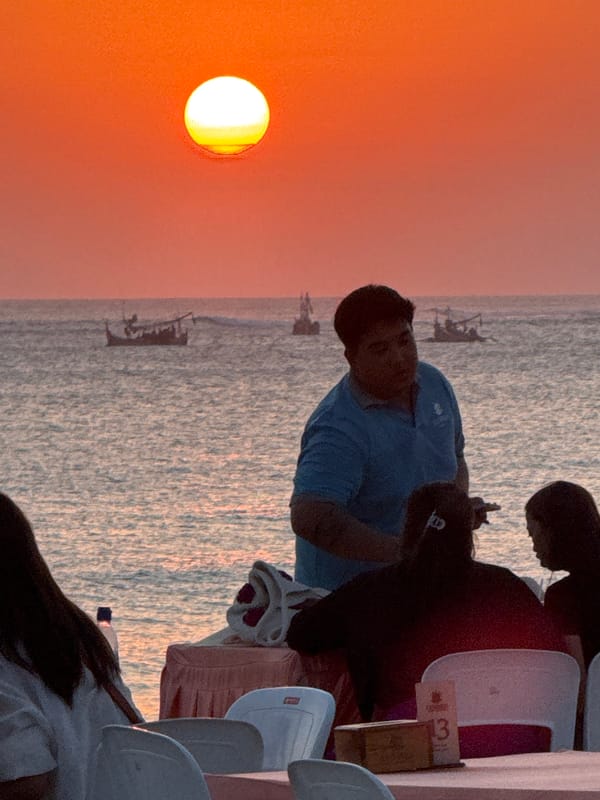 Sunset dining and tourism activity observed at Kuta Beach