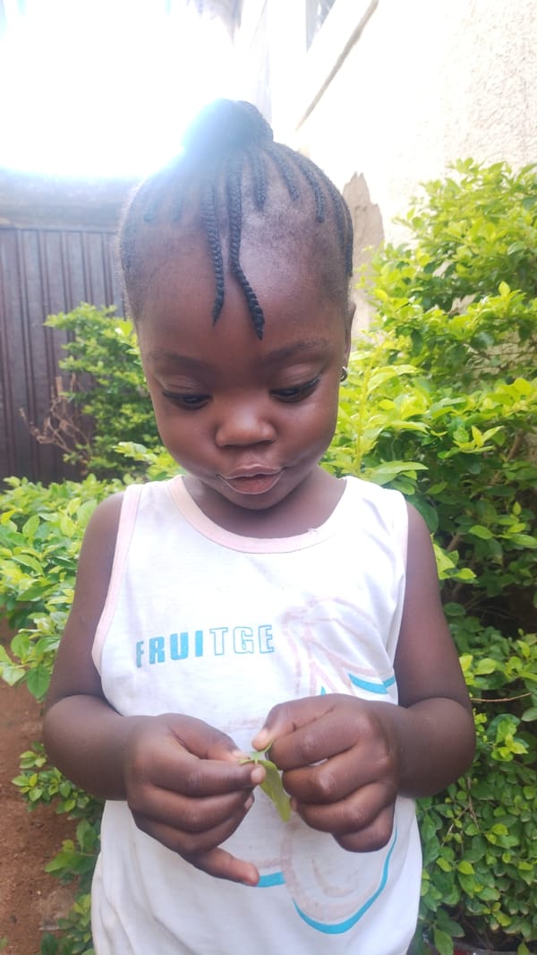 Child and cloudy skies documented in Jos, Nigeria morning