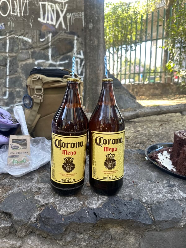 Birthday celebration features Corona beer bottles with candles in Mexico City
