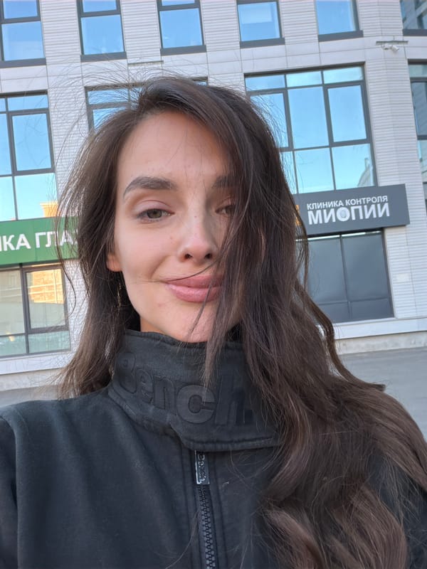 Selfies and playground time outside a modern Ufa apartment block
