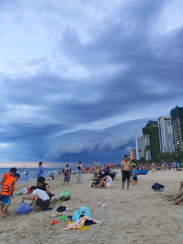 Storm clouds gather over Da Nang beach amid ongoing activities