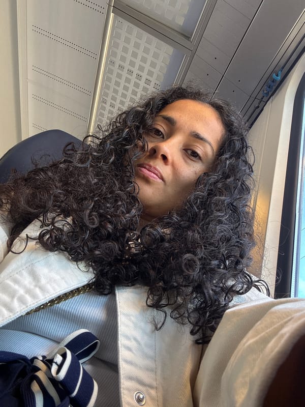 Person with curly hair photographed indoors in Sprinkange, Luxembourg