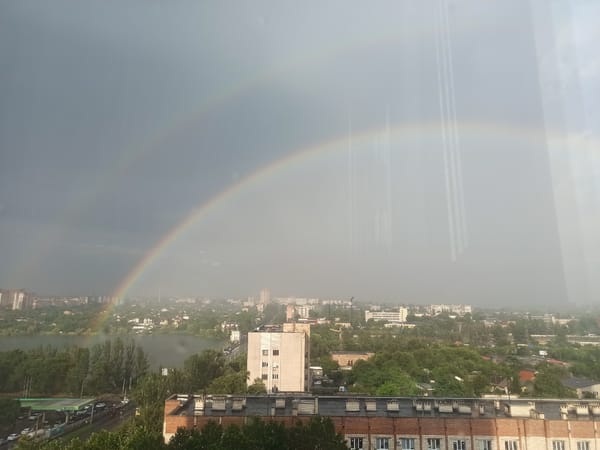 Double rainbow over the city, plus a nearby indoor event