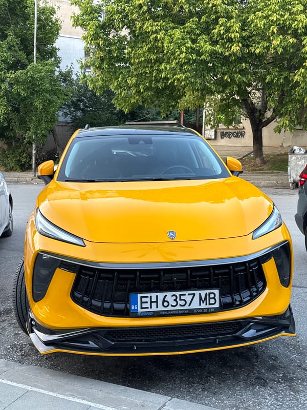 Yellow SUV parked outside graffiti-covered building in Pleven