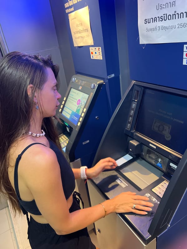 Woman makes cash deposit at Bangkok Bank ATM Thailand