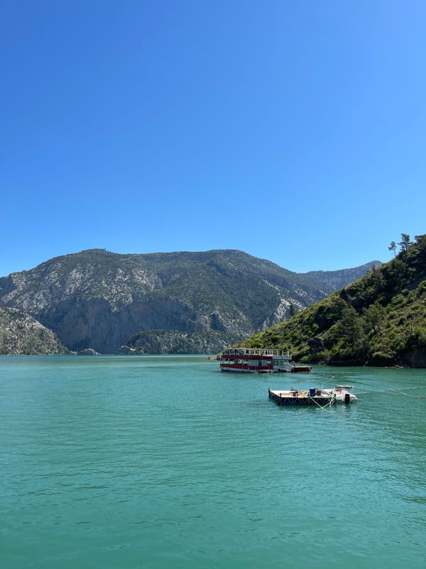 Mountain lake scene with docked boats photographed morning hours
