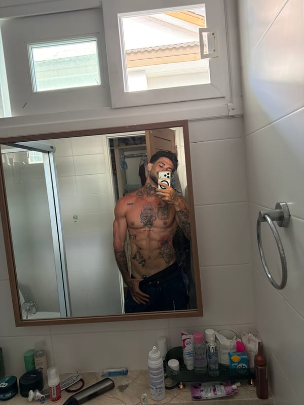 Man takes bathroom mirror selfies in Chalong, Thailand