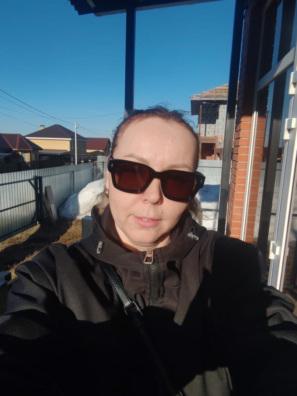 Woman takes selfie in residential Chaikovsky neighborhood