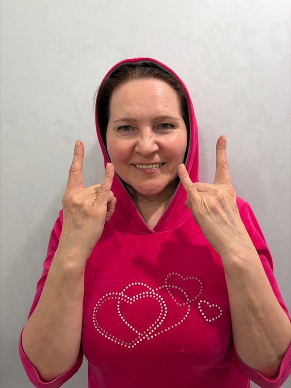 Woman in decorative fuchsia hoodie observed in Neftekamsk