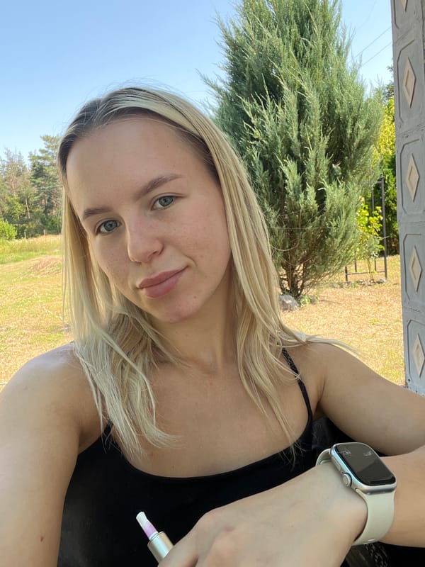 Outdoor selfie session near a decorative garden setting