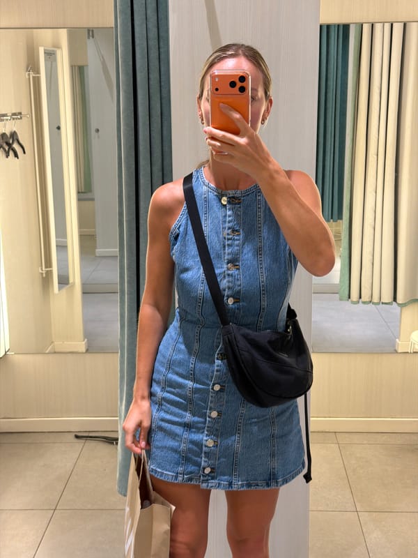 Trying on denim at a Mango store in coastal Spain