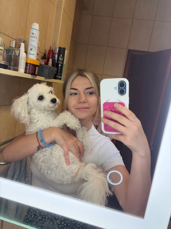 Mirror selfie with a white poodle in Budva