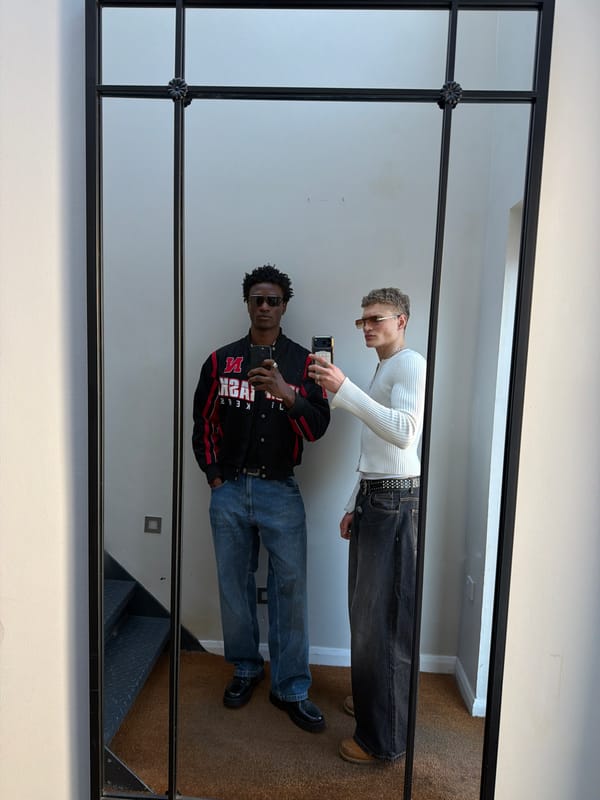 Two people take mirror selfie in London