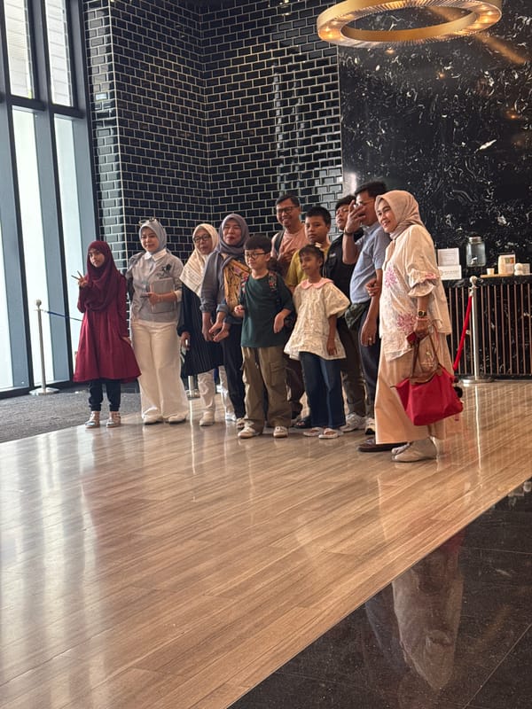 Family layover in Kuala Lumpur — lobby, coffee, and kids