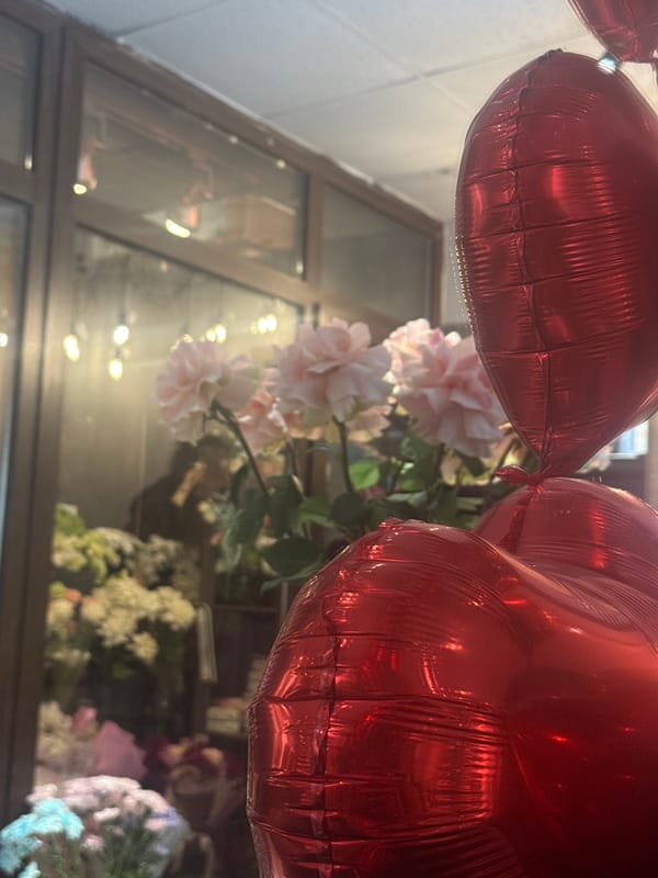 Heart balloons and flowers arranged indoors in Perm