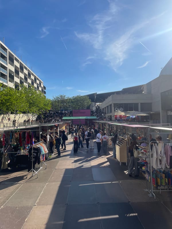 Woman DJs from pond booth at Barcelona outdoor market