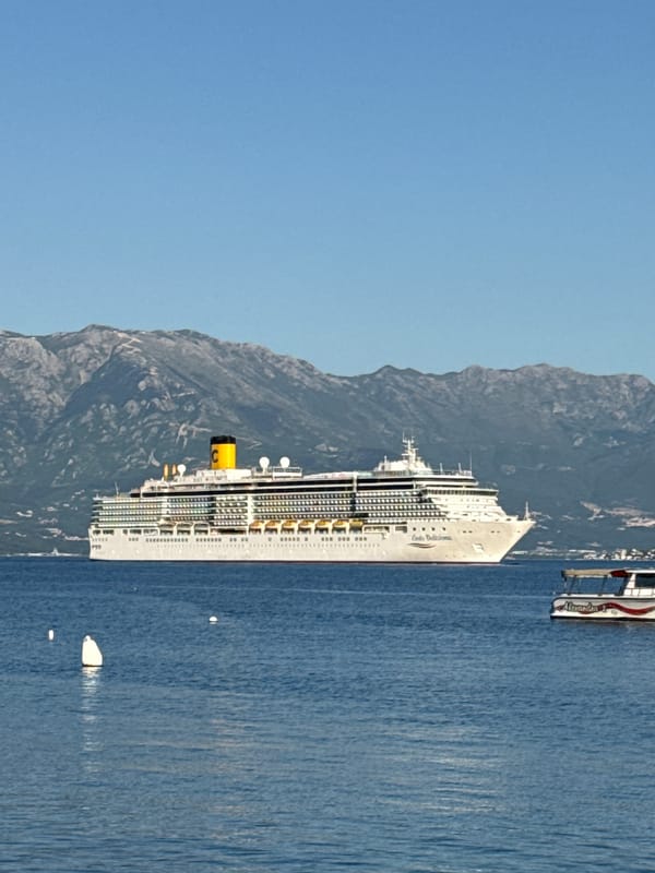 Costa Deliziosa cruise ship docks in Đenovići Montenegro harbor