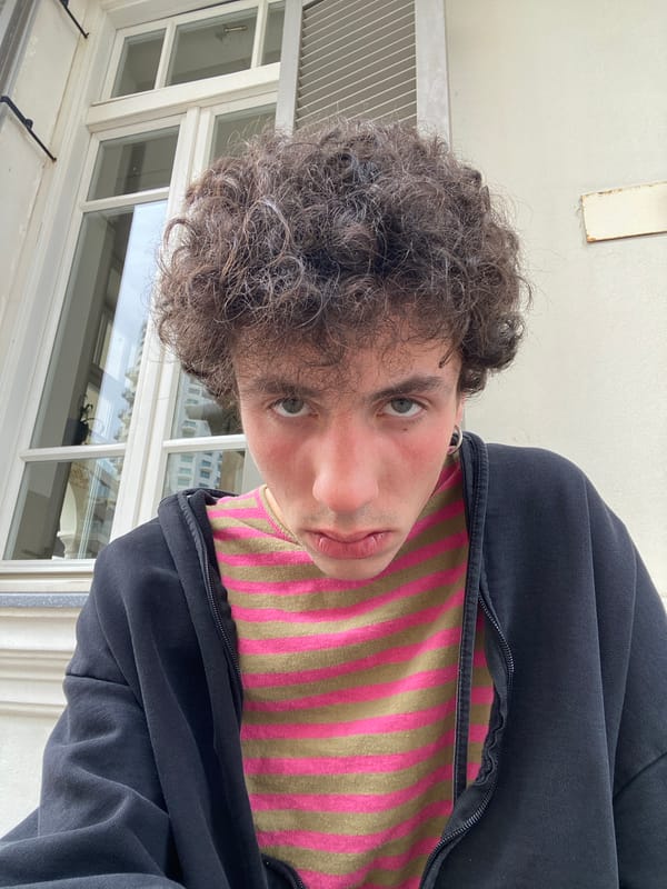 Person in striped shirt photographed indoors in Tel Aviv