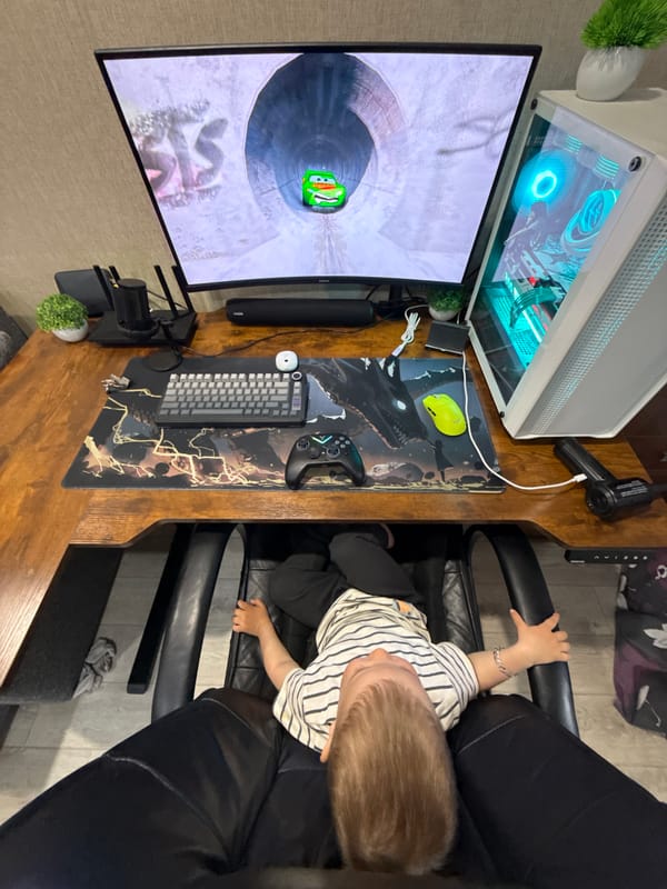 Toddler sits at home office desk in Rusanovo
