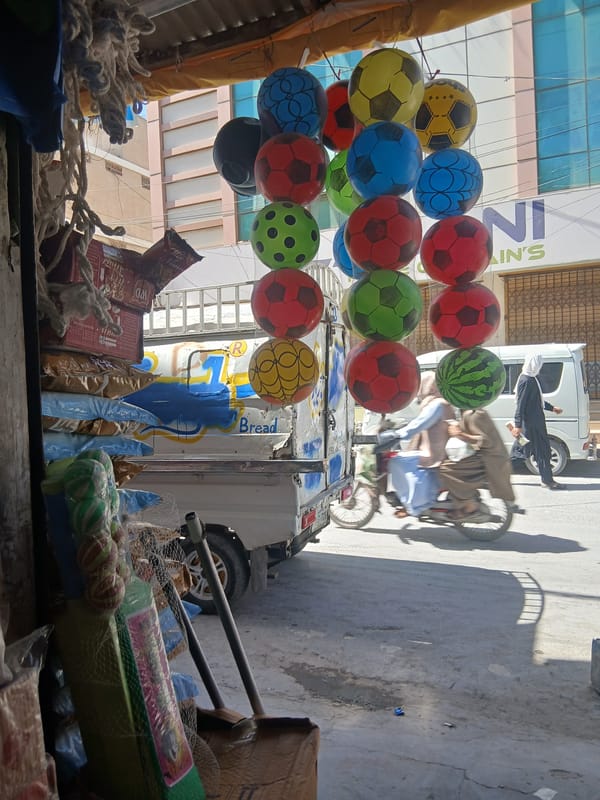Street vendor sells soccer balloons in Quetta, Pakistan