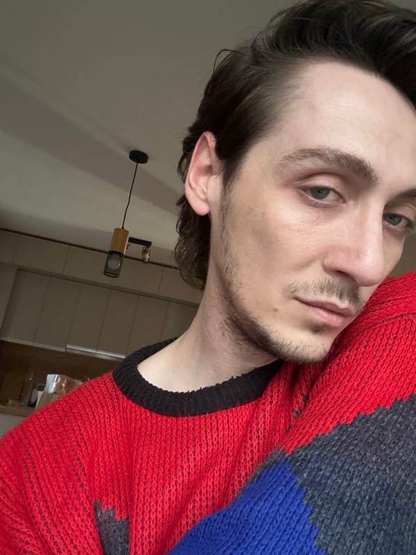 Portrait photo captured in Sofia shows man in striped sweater