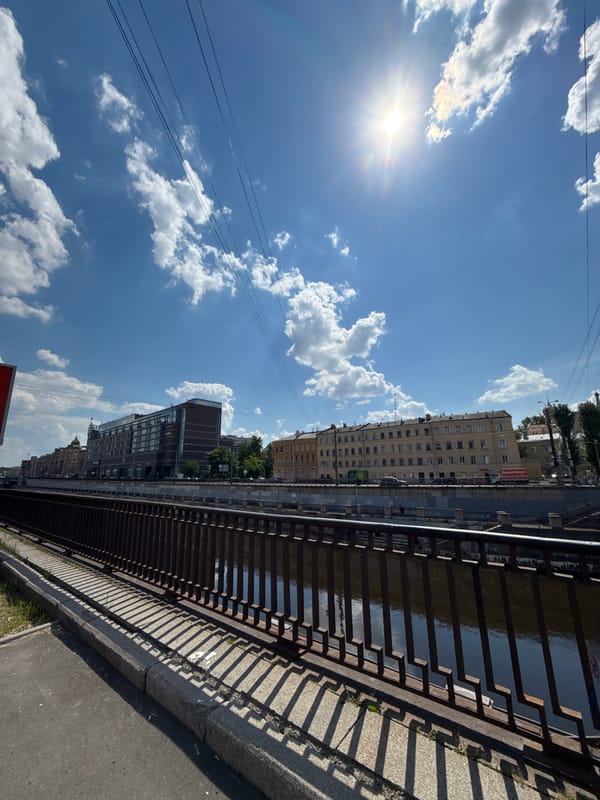 Woman documents sunny morning visit to urban canal district