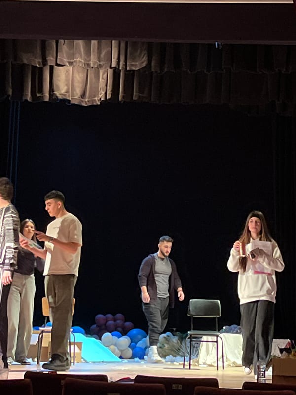 Three people interact on stage in Nova Zagora